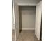 Empty walk-in closet with white shelving and white doors, ready to be organized with ample storage space at 349 Shadow Falls Dr, Wendell, NC 27591