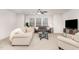Cozy living room features neutral tones and comfortable seating arrangements at 349 Shadow Falls Dr, Wendell, NC 27591