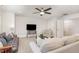 Bright living room with soft natural light and ceiling fan for added comfort at 349 Shadow Falls Dr, Wendell, NC 27591