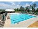 Spacious community pool with ample lounge chairs and a separate splash area at 349 Shadow Falls Dr, Wendell, NC 27591