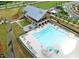 Aerial view of community pool, clubhouse, and well-maintained landscaping at 349 Shadow Falls Dr, Wendell, NC 27591