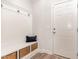 Mudroom with custom bench and storage baskets by the front door at 349 Shadow Falls Dr, Wendell, NC 27591