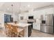 Modern kitchen featuring a large island with barstool seating and stainless steel appliances at 349 Shadow Falls Dr, Wendell, NC 27591