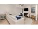 Bright living room featuring a fireplace, a white sofa, and stylish decor at 349 Shadow Falls Dr, Wendell, NC 27591
