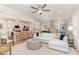 Bright living room featuring a modern kitchen, white sofa, and stylish decor at 349 Shadow Falls Dr, Wendell, NC 27591