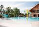 Exterior view of community pool and waterpark with slide and splash pad at 349 Shadow Falls Dr, Wendell, NC 27591