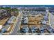 Community aerial view features well-maintained houses, roads, and landscaping on a sunny day at 3512 Dragonfly River Ct, Raleigh, NC 27604