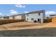 Spacious backyard with a wood fence, green space, and a patio set in the corner at 3512 Dragonfly River Ct, Raleigh, NC 27604