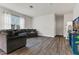 Inviting living room featuring hardwood floors and a comfortable gray sectional sofa at 3512 Dragonfly River Ct, Raleigh, NC 27604