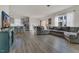Inviting living room featuring hardwood floors and a comfortable gray sectional sofa at 3512 Dragonfly River Ct, Raleigh, NC 27604