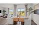 Elegant dining area filled with natural light, with views of the surrounding landscape at 369 Swift Creek Farm Ln, Clayton, NC 27520