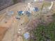 Aerial view of multiple homes and properties surrounded by trees and fields at 375 Thomas Arnold Rd, Zebulon, NC 27597