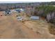 Aerial view of multiple properties with trees and a large area of land at 375 Thomas Arnold Rd, Zebulon, NC 27597