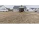 View of the backyard with an outdoor seating and wooded views at 375 Thomas Arnold Rd, Zebulon, NC 27597