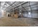 Barn interior showing stalls, steel girders and frame, and ATV at 375 Thomas Arnold Rd, Zebulon, NC 27597