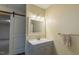 Bathroom features a vanity, a sliding barn door, and modern fixtures, combining functionality with rustic charm at 375 Thomas Arnold Rd, Zebulon, NC 27597