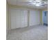 A carpeted bedroom featuring a ceiling fan and large closet for optimal storage solutions in a home at 375 Thomas Arnold Rd, Zebulon, NC 27597