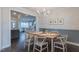 Elegant dining room featuring modern chandelier and table with seating for six at 375 Thomas Arnold Rd, Zebulon, NC 27597