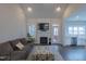 Open concept living room features vaulted ceilings, fireplace, and adjoins kitchen area at 375 Thomas Arnold Rd, Zebulon, NC 27597
