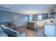 Bright room featuring a couch, a large kitchen, and a neutral color scheme creating a comfortable and inviting space at 375 Thomas Arnold Rd, Zebulon, NC 27597