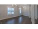 Bright entryway featuring modern light fixture, large window and coat closet at 375 Thomas Arnold Rd, Zebulon, NC 27597