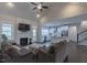 Open concept living room with fireplace and a seamless flow into the modern kitchen at 375 Thomas Arnold Rd, Zebulon, NC 27597