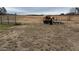 View of grazing horses near an iron gate in an open pasture at 375 Thomas Arnold Rd, Zebulon, NC 27597