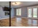 Finished basement featuring a fireplace, flatscreen TV, light blue walls, and view to outdoors at 415 Westbury Dr, Chapel Hill, NC 27516