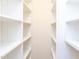 Clean and well-organized walk-in closet with shelving at 415 Westbury Dr, Chapel Hill, NC 27516