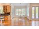 Bright dining area features hardwood floors, modern light fixture, and access to an outdoor deck at 415 Westbury Dr, Chapel Hill, NC 27516