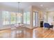 Charming dining area with a modern table, clear chairs, and views of the outdoors at 415 Westbury Dr, Chapel Hill, NC 27516