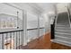 Elegant staircase featuring hardwood steps, carpet runner and iron railing at 5301 Mandrake Ct, Raleigh, NC 27613