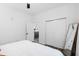 Minimalist bedroom with closet, wood floors, and open doorway at 615 Daniels St # 318, Raleigh, NC 27605