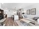 Open-concept living space showcasing a modern kitchen with an island and a comfortable living room area at 615 Daniels St # 318, Raleigh, NC 27605