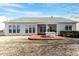 Home backyard, featuring a brick patio set, lawn and multiple windows at 627 Aylestone Dr, Cary, NC 27519