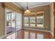 Sun-filled breakfast nook with sliding glass doors leading to patio at 627 Aylestone Dr, Cary, NC 27519