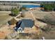 Custom home with metal roof near pond with expansive acreage and beautiful mature trees at 6509 Zebulon Rd, Wake Forest, NC 27587