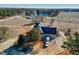 Aerial view of a new home, lake, and surrounding treed acreage at 6509 Zebulon Rd, Wake Forest, NC 27587
