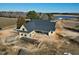 New construction home with a dark metal roof and wrap around porch on a large lot with lake views at 6509 Zebulon Rd, Wake Forest, NC 27587