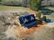 New construction home with a dark metal roof and wrap around porch on a large lot at 6509 Zebulon Rd, Wake Forest, NC 27587