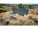 Aerial view of the new construction home with dark roof and pale yellow siding at 6509 Zebulon Rd, Wake Forest, NC 27587