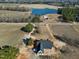New construction home with a dark metal roof and wrap around porch on a large lot with lake views at 6509 Zebulon Rd, Wake Forest, NC 27587