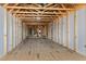 Framed attic featuring exposed beams and a window for natural light at 6509 Zebulon Rd, Wake Forest, NC 27587