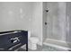 Contemporary bathroom with a walk-in shower and elegant fixtures at 6509 Zebulon Rd, Wake Forest, NC 27587
