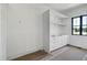 Walk-in closet featuring built-in drawers and shelves for efficient organization at 6509 Zebulon Rd, Wake Forest, NC 27587