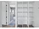 Bright walk-in closet with built-in shelves, providing ample storage space at 6509 Zebulon Rd, Wake Forest, NC 27587