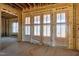 A grand entrance hall with custom wood doors and a window with great natural light at 6509 Zebulon Rd, Wake Forest, NC 27587