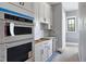 A bright kitchen features white cabinets, stainless steel appliances, and modern design at 6509 Zebulon Rd, Wake Forest, NC 27587