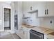 Kitchen featuring stainless appliances, white cabinetry, and undermount sink at 6509 Zebulon Rd, Wake Forest, NC 27587