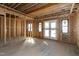 Framed living room with windows and door ready for your design and finishes at 6509 Zebulon Rd, Wake Forest, NC 27587
